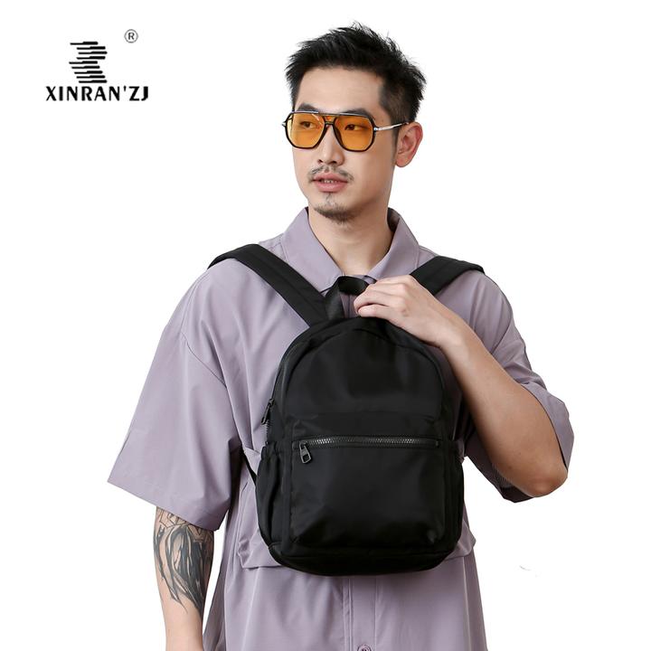 轻便防水双肩背包休闲旅行随身大容量新款百搭简约书包学生双肩包