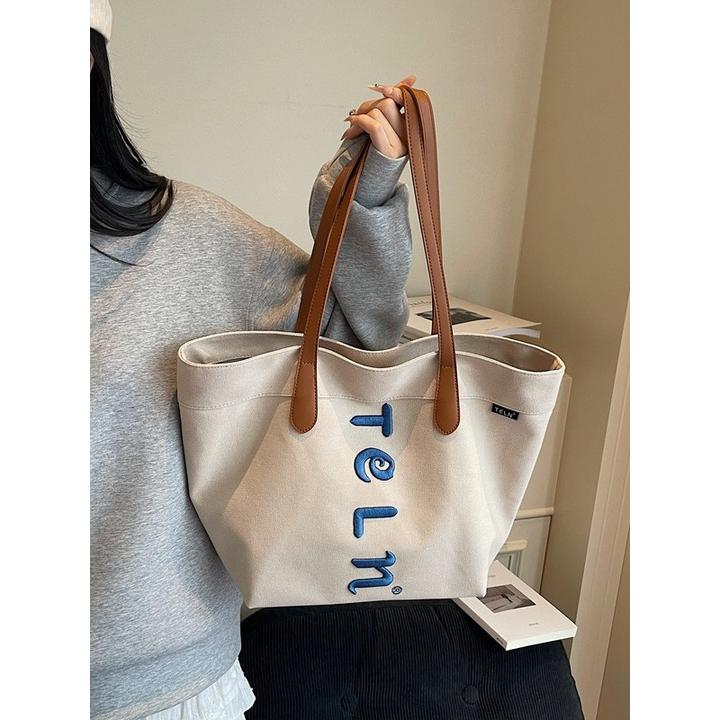 原宿风爆款刺绣厚实帆布包包2025新款百搭休闲大容量托特单肩包女