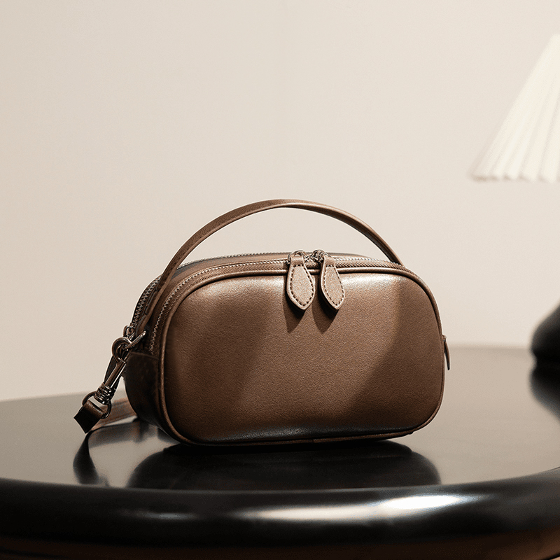 牛皮小圆包女2025新款真皮复古女士斜挎包时尚百搭小众单肩小包包