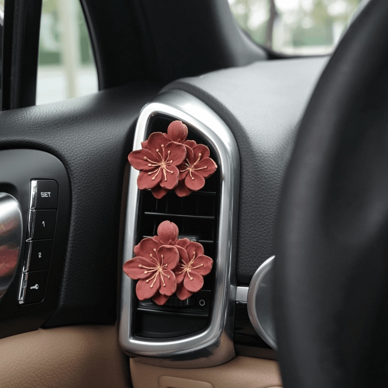 车载美观红梅梅花汽车空调出风口香水高级感车内装饰扩香石摆件女
