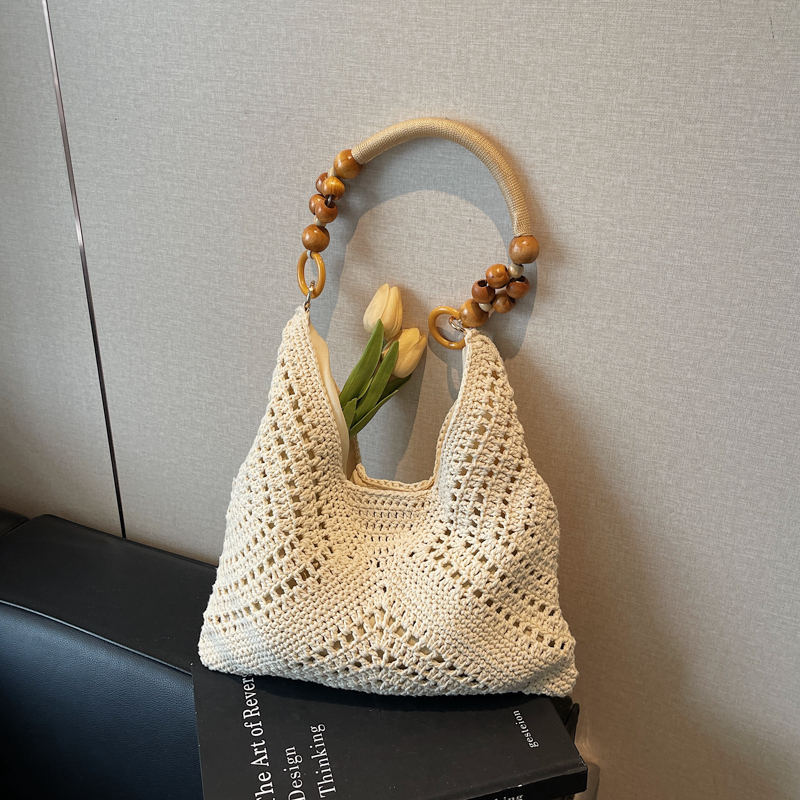 手工编织包包女式2025新款潮海边度假单肩包斜挎水桶包沙滩草编包
