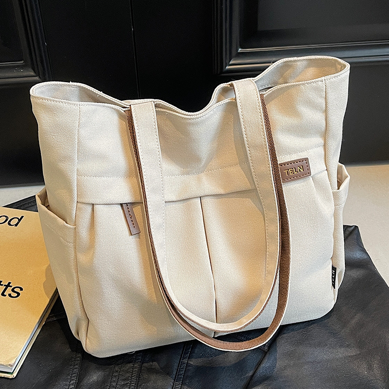 大容量帆布包包女2025新款春夏休闲单肩包大学生上课通勤包托特包