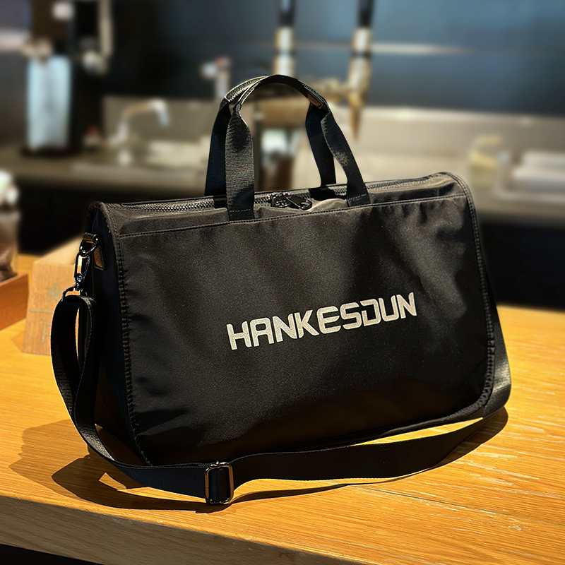 新款旅行包通勤风电脑包拉链短途时尚英文男女商务公文包