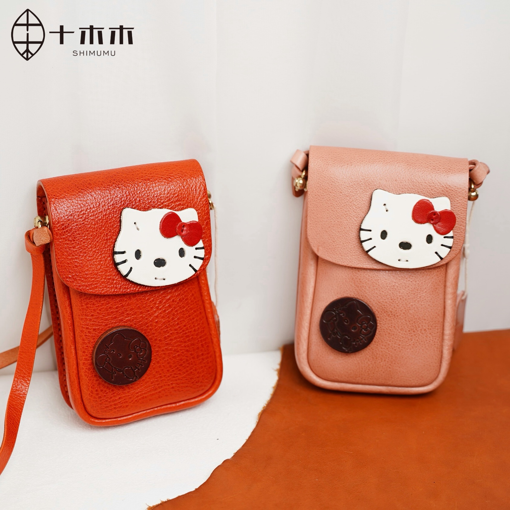 十木木加厚植鞣牛皮hellokitty休闲手缝线手机包女新款可爱卡通包