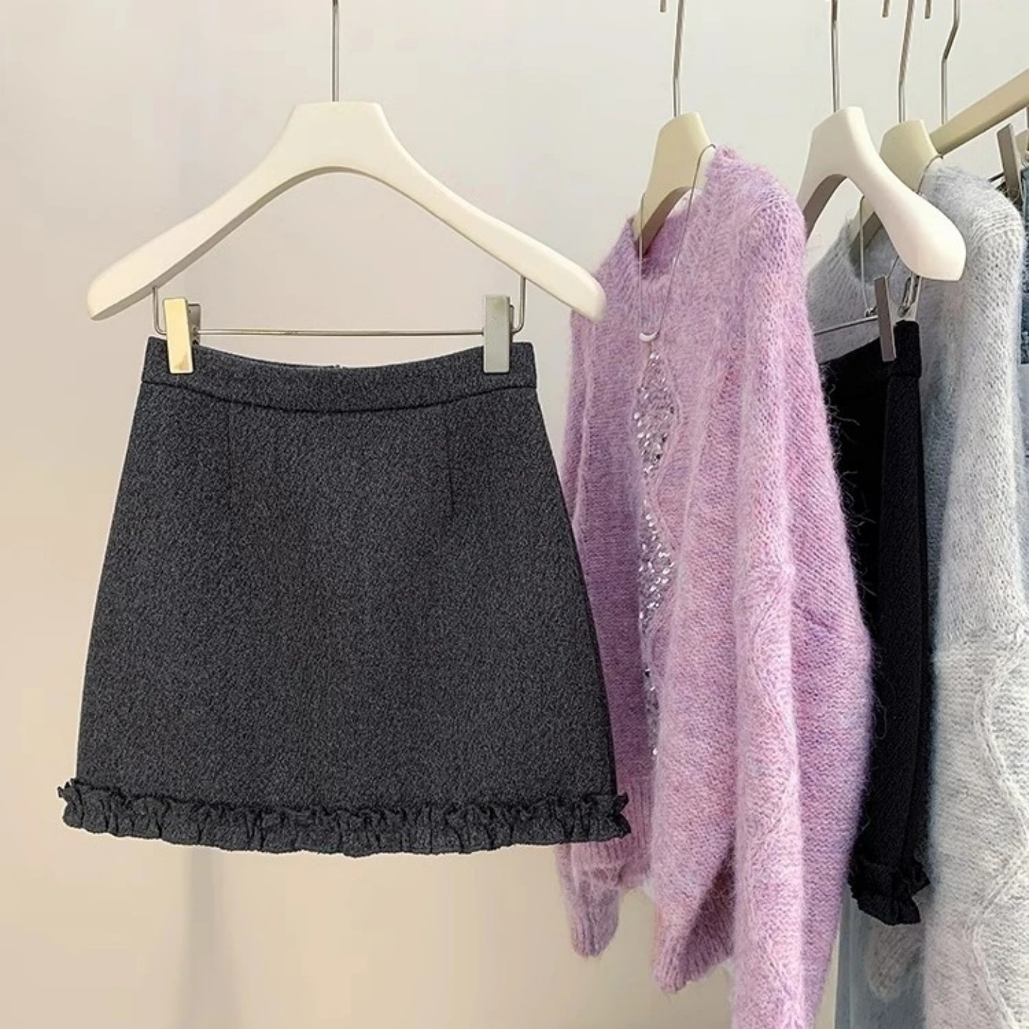 韩版时尚木耳边拼接毛呢短裙女2025秋冬新款高腰时尚气质包臀短裙