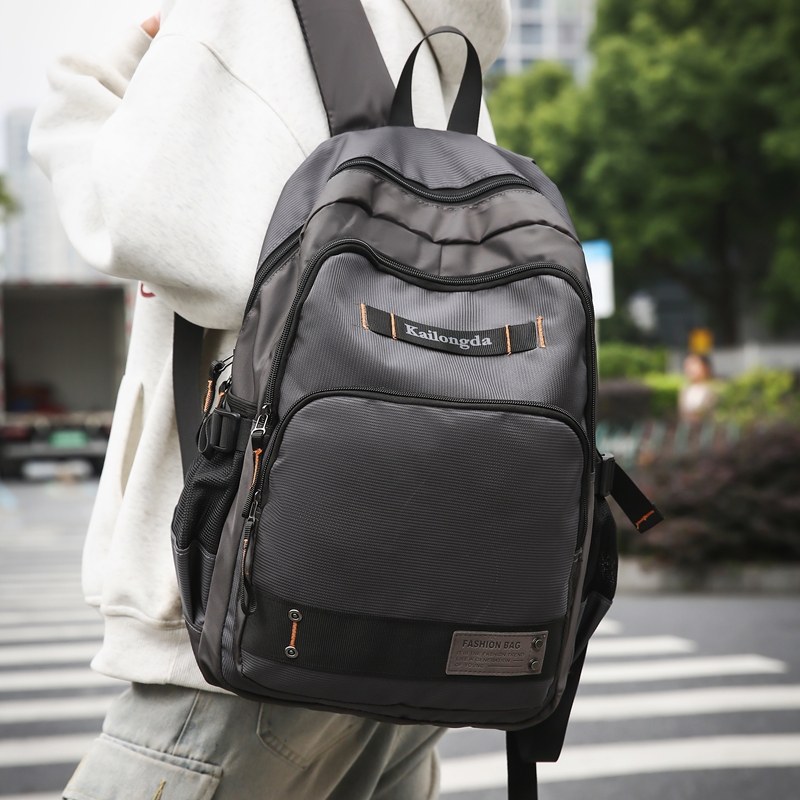 新款时尚男士双肩包休闲百搭大容量户外书包双背包女韩版潮流