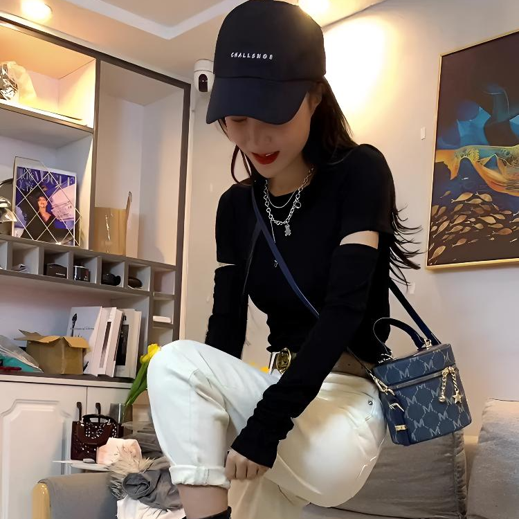 正肩时髦破洞镂空黑色长袖t恤女春秋内搭韩范短款修身收腰打底衫