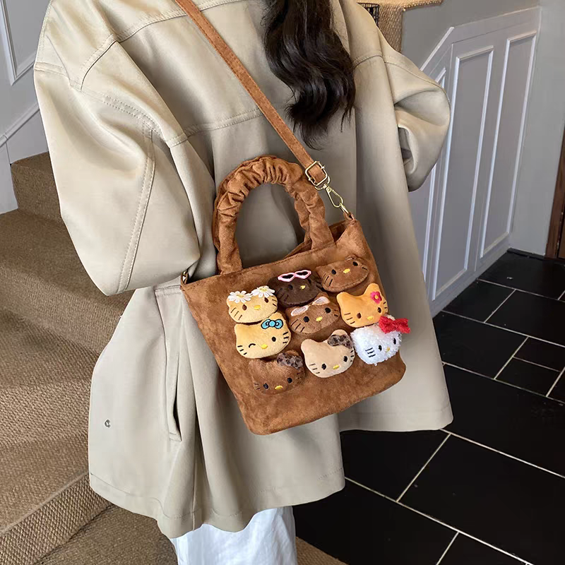 新款豹纹水桶包小女孩可爱玩偶手拎出游百搭单肩斜挎包