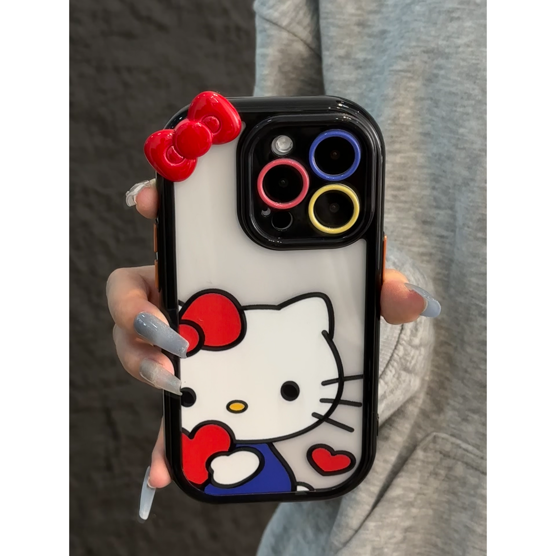 欧克里里蝴蝶结抱爱心Kitty适用苹果16手机壳华为vivo小米15oppo