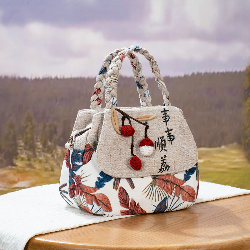 2025年新款民族风手提斜跨休闲单肩包原创设计时尚百搭小众文艺包